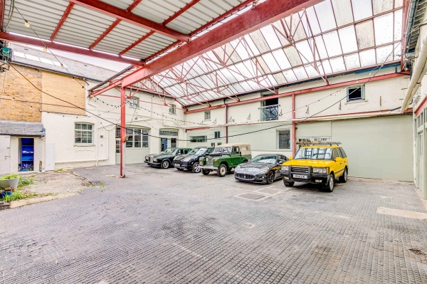 Premium car photography and commercial filming location space with industrial warehouse backdrop, curated by Love Locations.