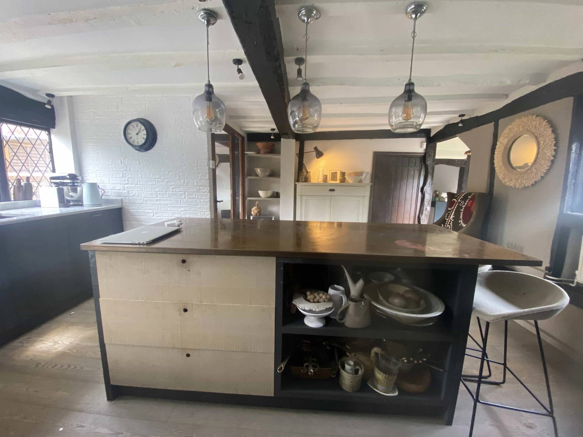 Traditional cottage kitchen island setup with open shelving and vintage storage elements inside an authentic Tudor property, Love Locations RG9.
