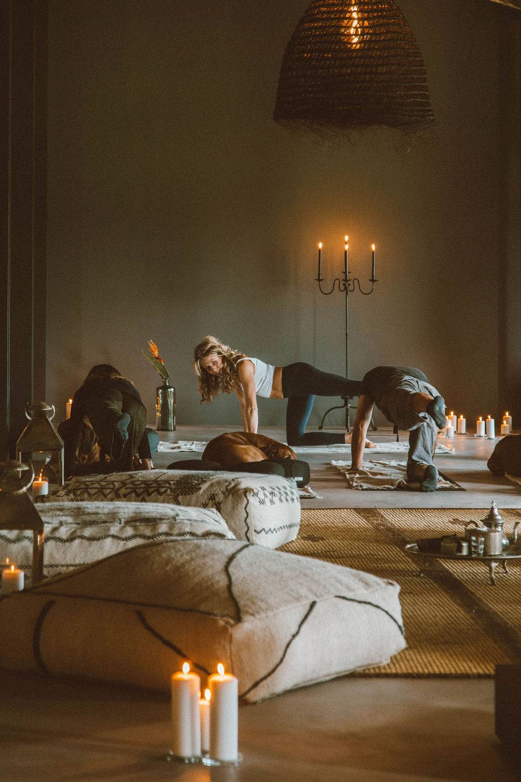 Private wellness yoga studio with floor mats, candle lighting, and warm moody wall tones, Love Locations 07630.