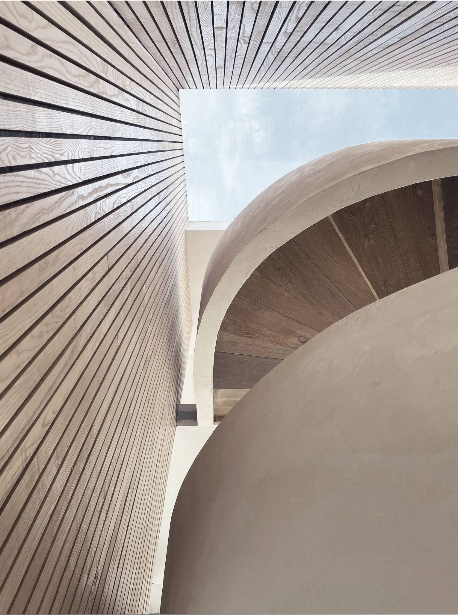 Low-angle architectural perspective of a curved plaster spiral staircase framing exterior timber cladding, Love Locations PO18.