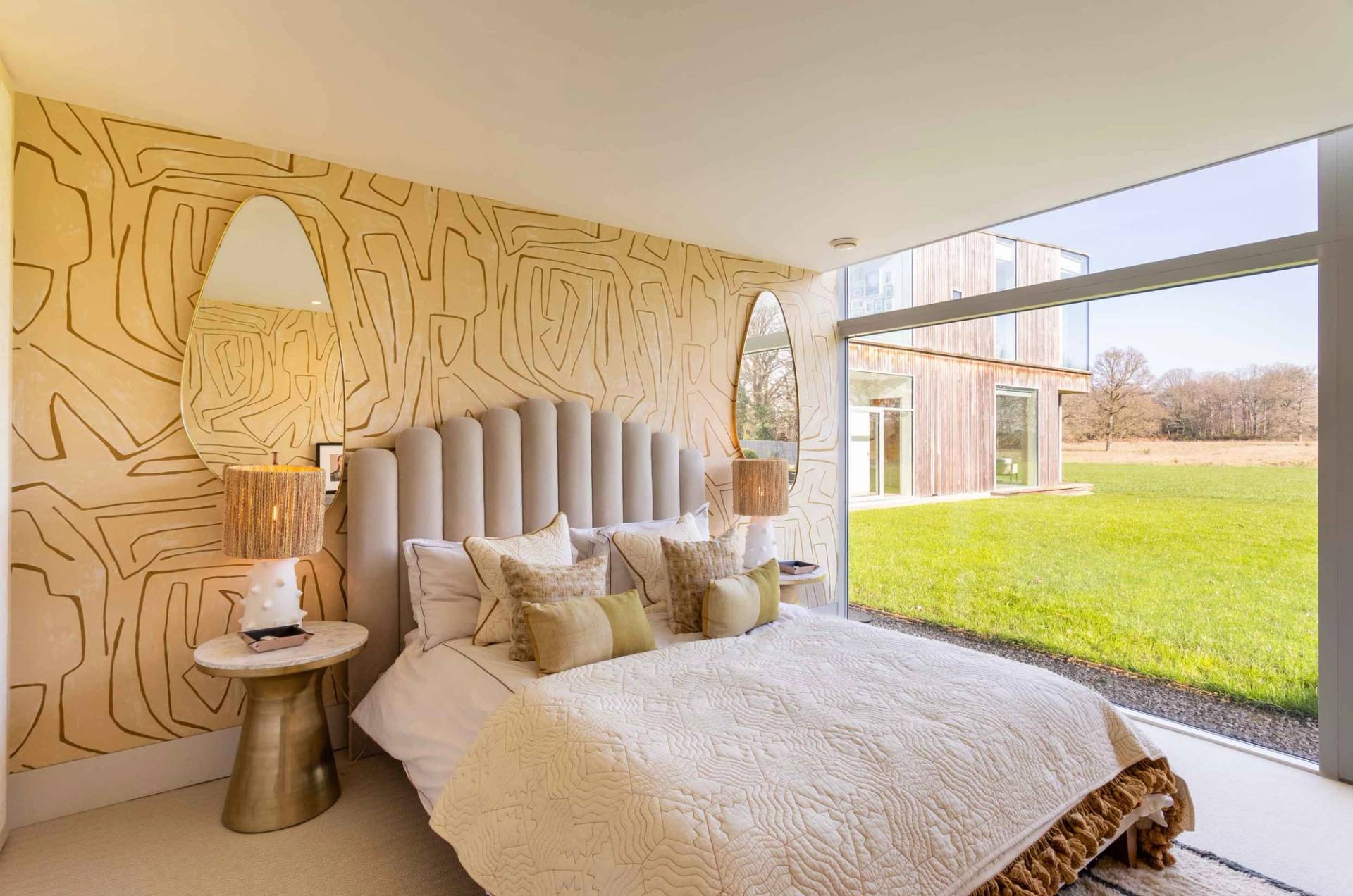 Love Locations creative interior style GU8: Luxury bedroom suite decorated with continuous line abstract face wallpaper and an elegant grey velvet channel-tufted headboard, perfect for TV sets.