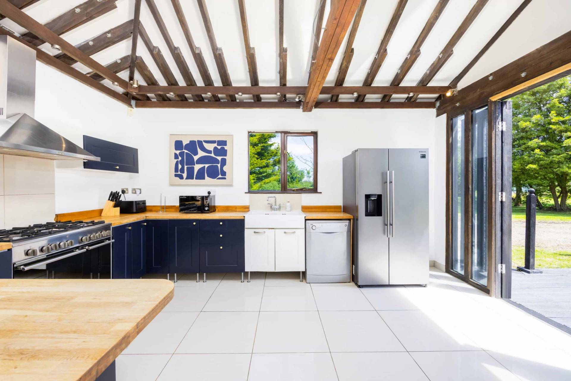 Converted barn interior with exposed beams in RM4 Essex – Love Locations