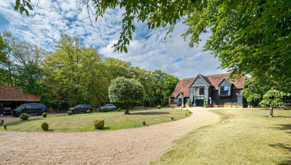 Exterior view of contemporary barn house in Essex, Love Locations