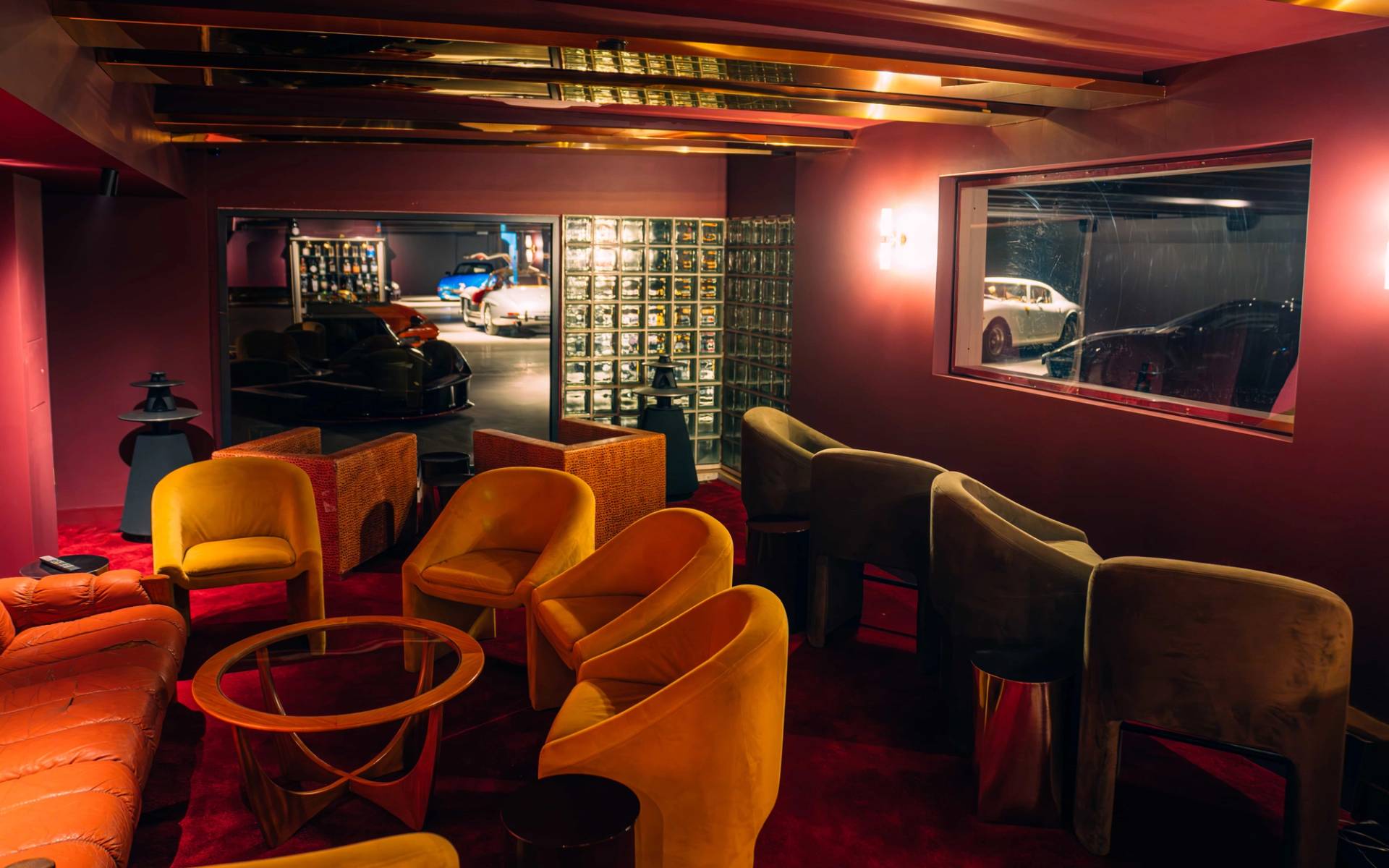 Retro lounge area shoot space with yellow velvet armchairs and dark timber panelling in Brentford TW8 from Love Locations.