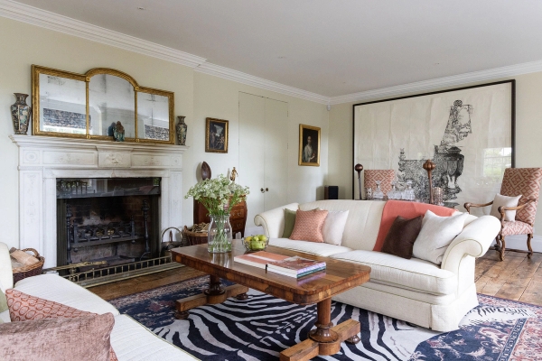Love Locations luxury manor house location BN44: Sophisticated double reception room showcasing high ceilings, refined English heritage decor, and plush seating, optimized for commercial video productions.