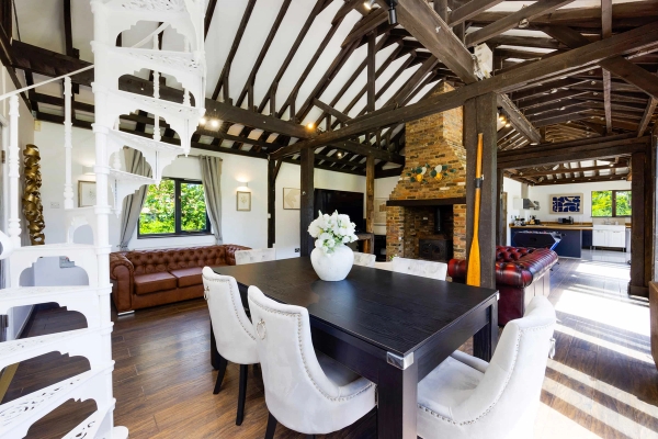 Rustic barn interior with large windows in RM4 Essex – Love Locations