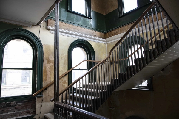 Weathered brick staircase in a derelict Peckham Rye billiards hall, part of the Love Locations Old Waiting Room venue for film shoots, pop-up exhibitions, and unique private events.