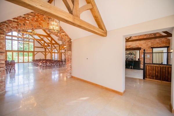 Bright barn conversion interior showing transition spaces for catering and event production, a Love Locations exclusive venue.