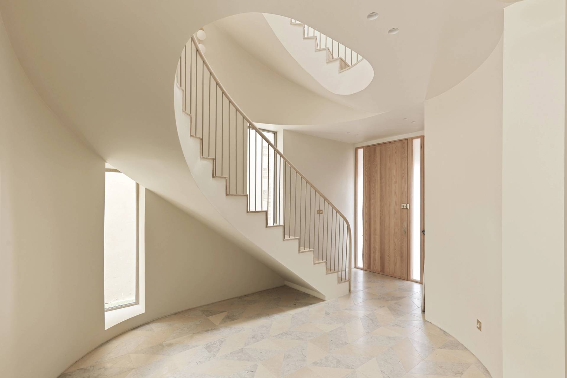 Striking architectural curved helical staircase in a luxury home location in Clapham South SW11 from Love Locations.