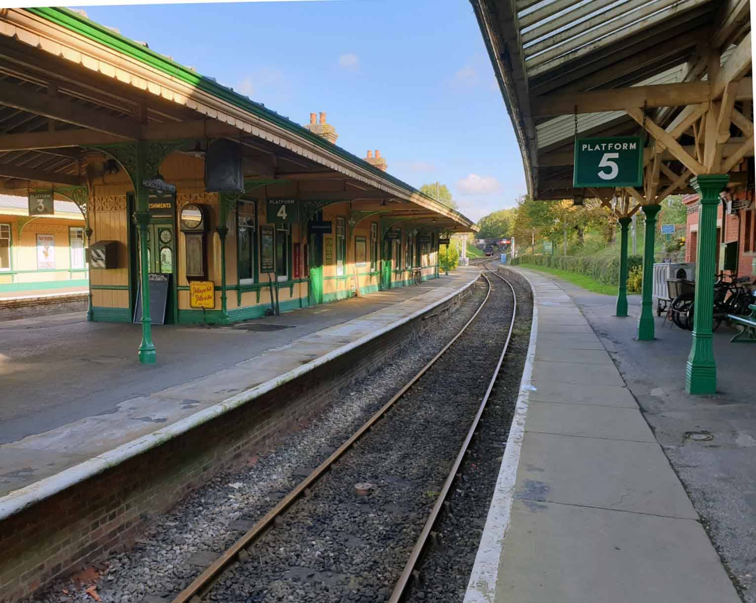 Heritage railway platform canopy and curved tracks in Sheffield Park, Uckfield, Sussex, Love Locations.