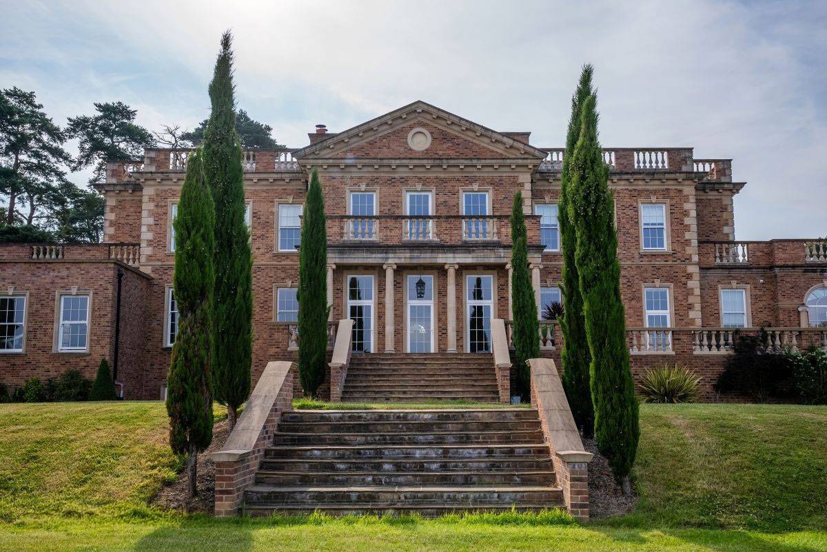 Imposing brick and stone entrance steps of the Greentrees country manor, a dramatic architectural setting by Love Locations.