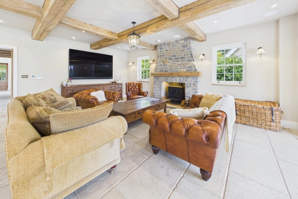 Love Locations cosy luxury living room with exposed beams and fireplace for TV and film