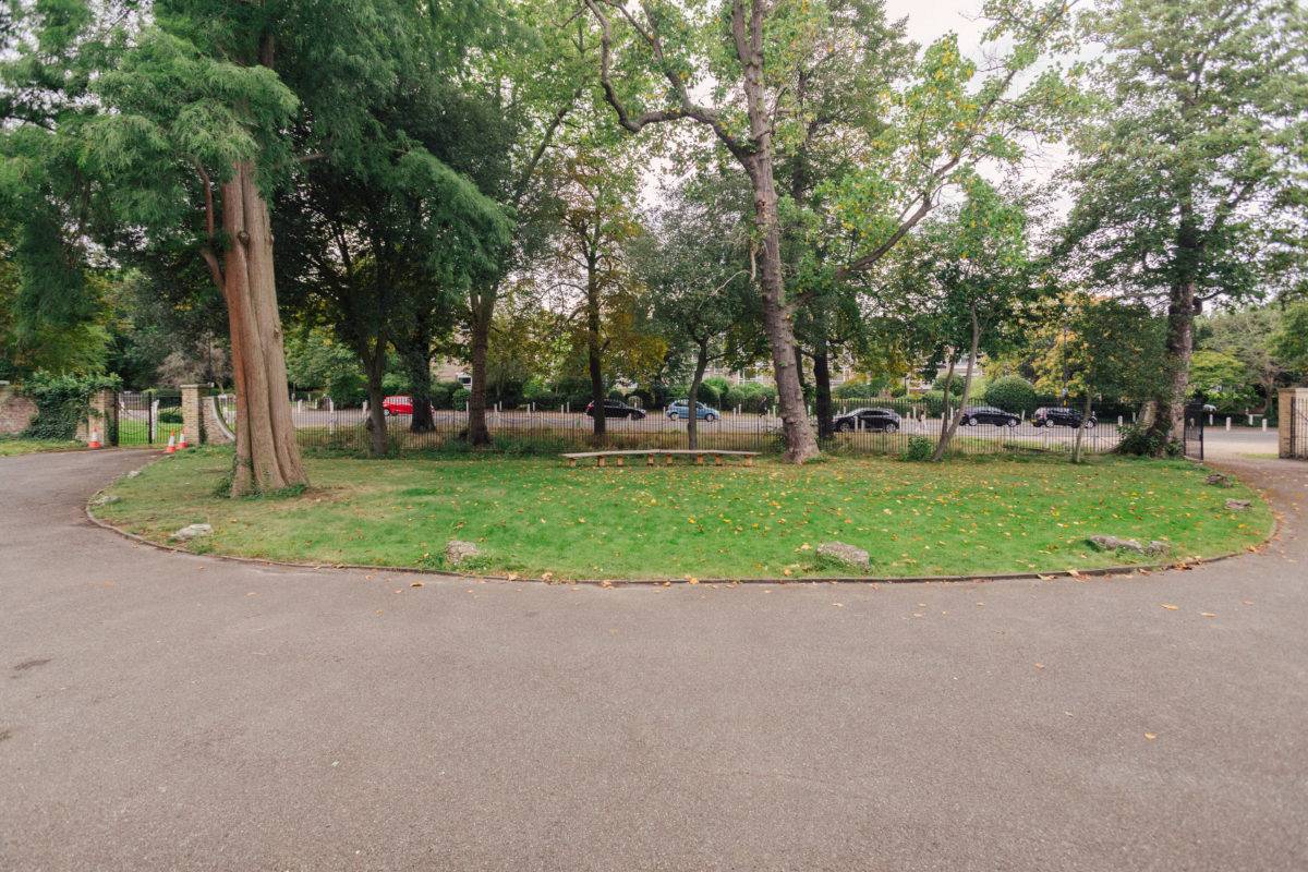 Tree-lined perimeter pathway and driveway surrounding private estate grounds, Love Locations SE15.