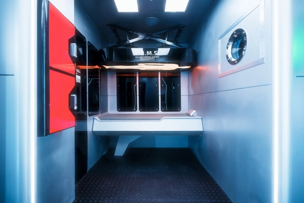 Futuristic laboratory research workstation set with sleek black monitors for sci-fi drama filming, Love Locations.