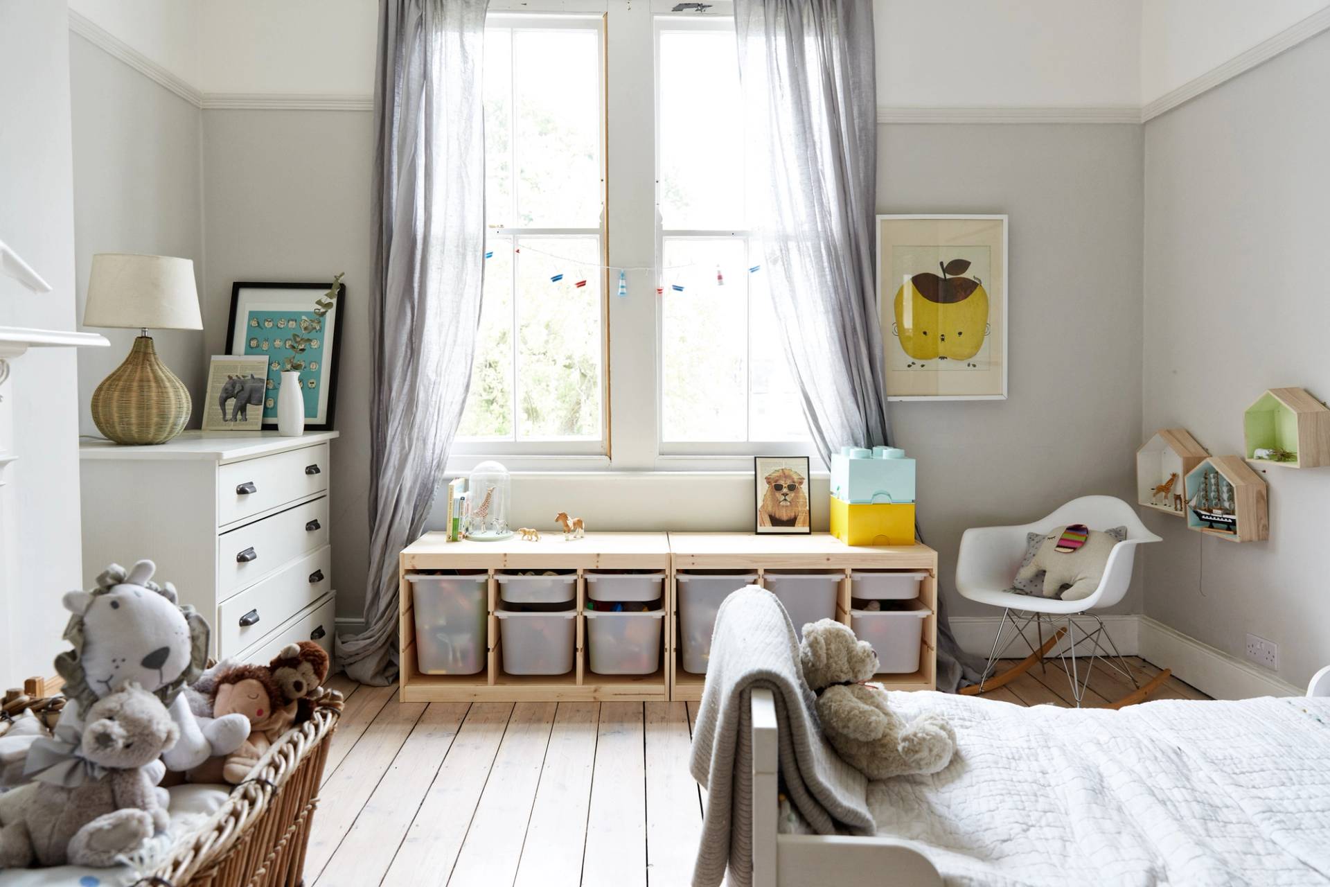 Kids bedroom in Southgate, N13 featuring low storage units, grey window drapes, and neutral timber floors, Love Locations.