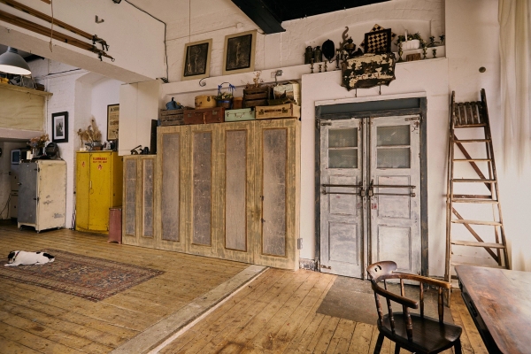 Distressed double factory doors and vintage wooden lockers inside a historic 1890s industrial warehouse location in EN5, Love Locations.