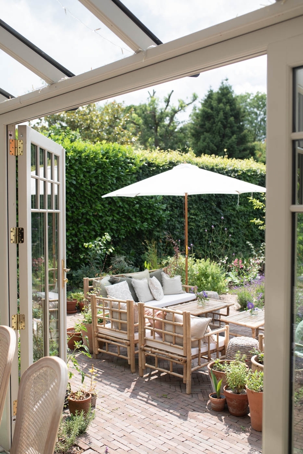 Modern residential garden in Horsley, Surrey with open green space and architectural detail, Love Locations location.