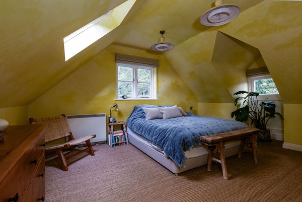 Bright yellow landing with period styling at Love Locations house in Liss, Hampshire GU33.