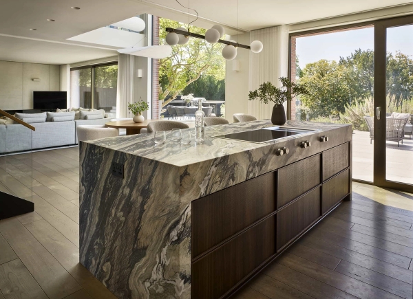 High-end luxury kitchen shoot location featuring a book-matched green marble island and minimalist design, Love Locations.