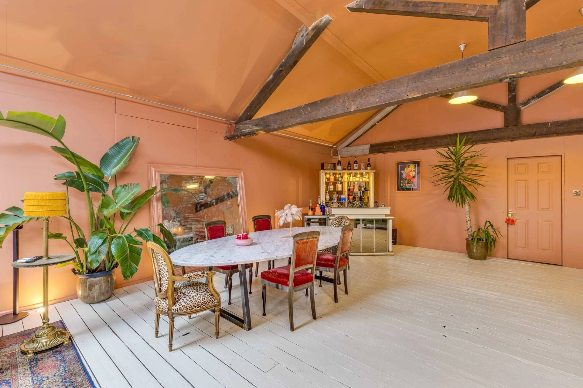 Mid-century modern dining room film location with an elegant marble table and retro seating, Love Locations property.