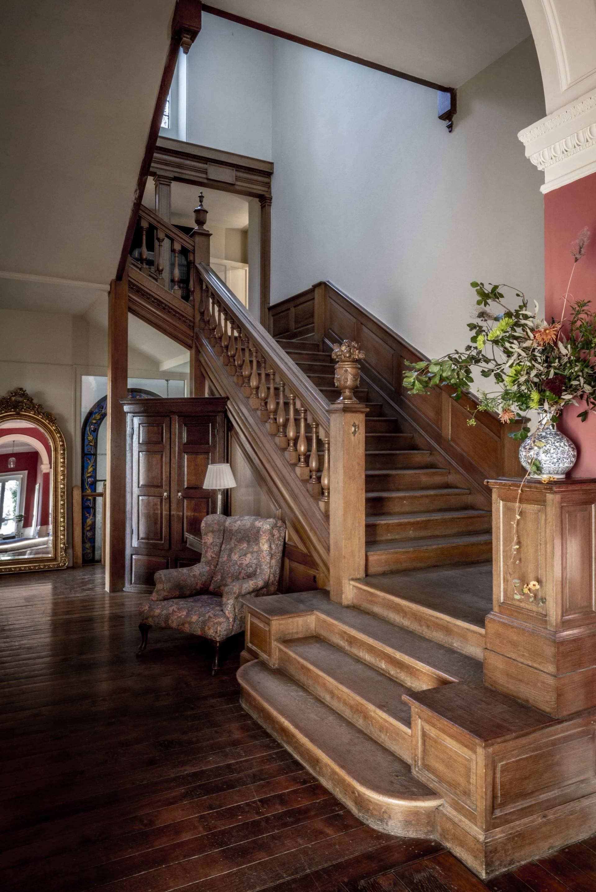 Grand carved oak staircase and panelled entrance hall in a Victorian manor house, ideal for historical drama filming, Love Locations.