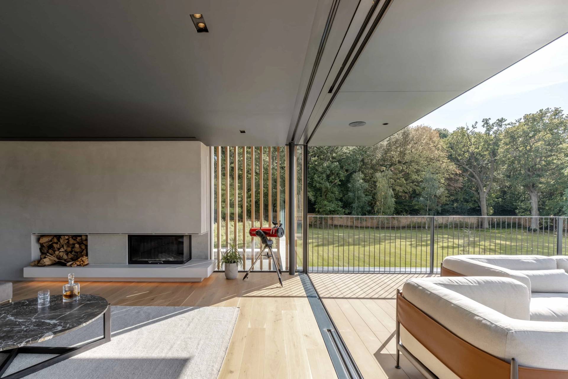 Covered outdoor patio lounge overlooking green countryside, ideal for premium outdoor furniture and lifestyle brand advertising, Love Locations CM4.