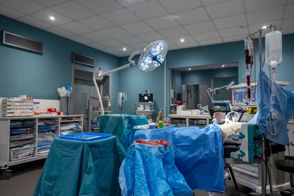 Hospital operating theatre set up with surgical lights, covered operating table, and medical monitors, Love Locations UB4.