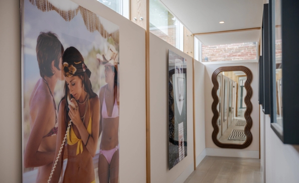 Love Locations high fashion backdrop location Surrey: Bright minimalist upper gallery corridor decorated with large, stylized graphic pop-art panels, perfect for creative editorial concepts.