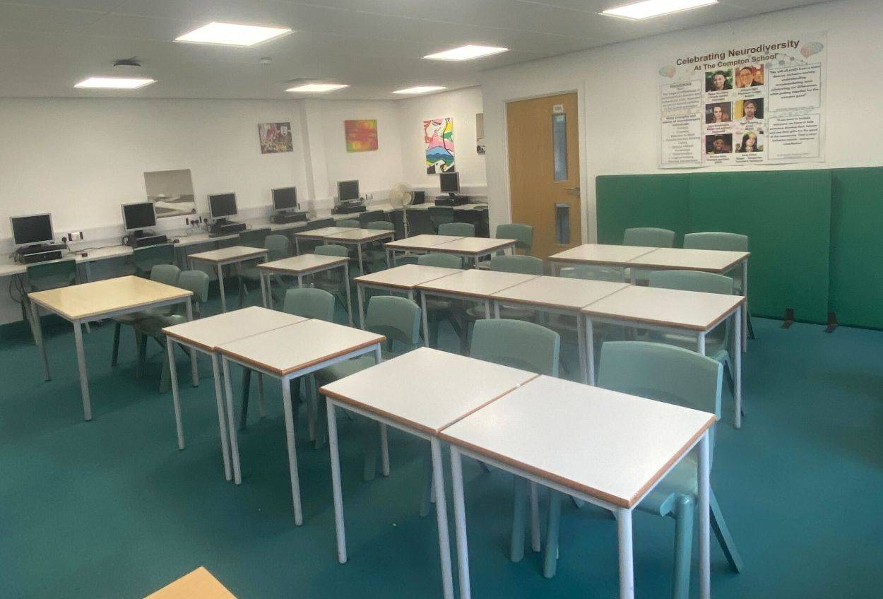 Computer lab and classroom photo location with arranged study desks and green-backed chairs in Barnet N12 by Love Locations.
