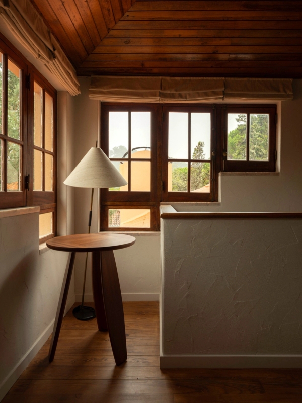 Mezzanine hallway landing with timber windows, half-height wall, and warm wood ceiling panels, Love Locations 2705-064.