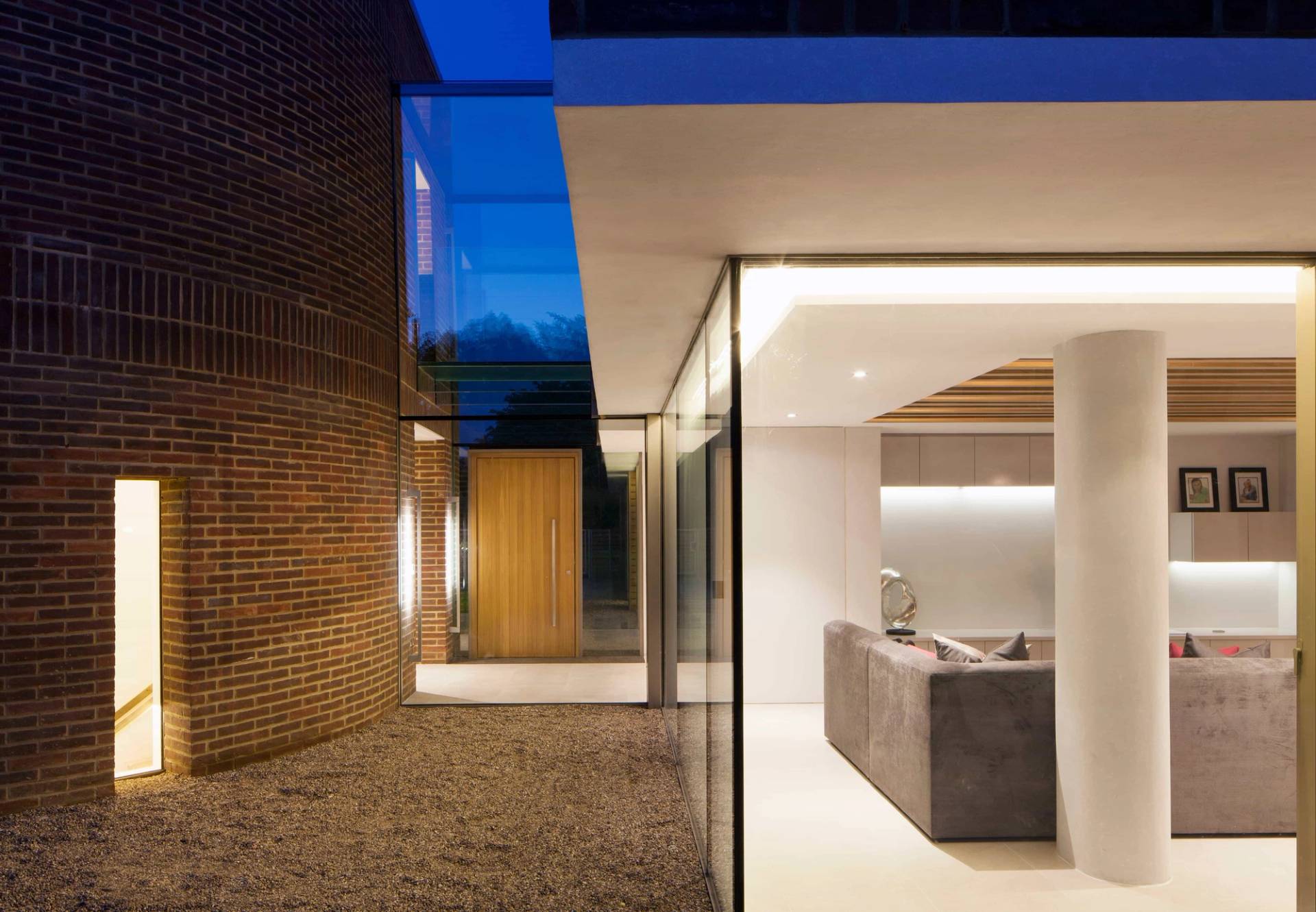 Exterior glass hallway detail connecting modern brick building structures in Radlett, Love Locations WD7.