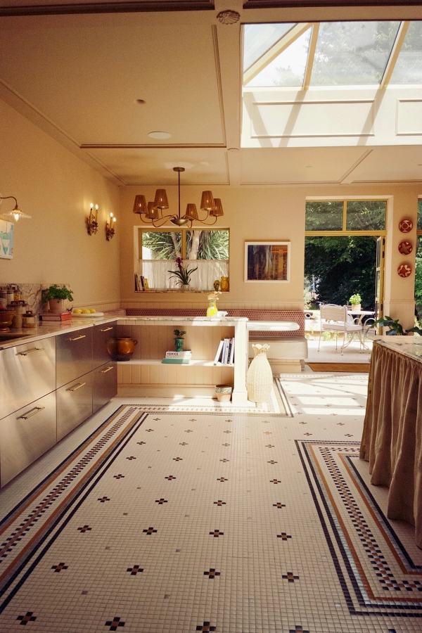 Eclectic open-plan kitchen and dining shoot location in Isleworth, Hounslow, West London, TW7 featuring stainless steel cabinets, tiled mosaic floors, and warm ambient lighting, ideal for food media and commercial cooking shows via Love Locations.