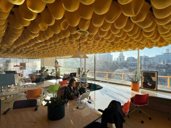 Stylish East London workspace with vibrant ceiling installation and lounge seating in Whitechapel – love locations