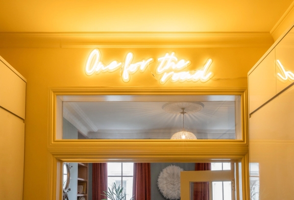 Unique doorway feature with a glowing neon sign reading "One for the road", a vibrant London shoot location in Westminster SW1V by Love Locations.