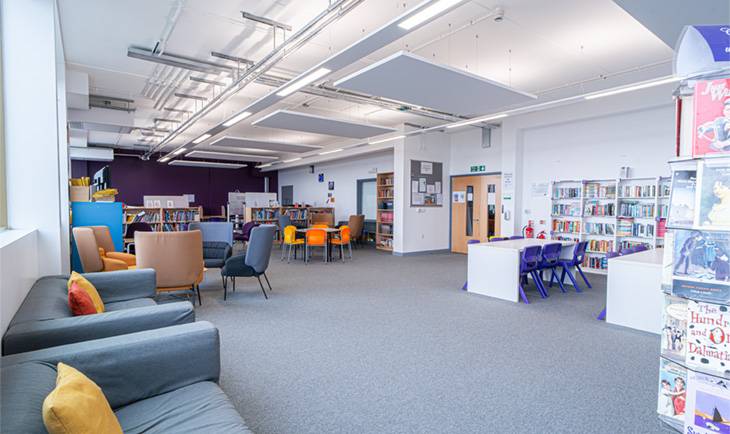 Bright school library learning hub shoot space in Hove BN3 with armchairs, bookshelves, and contemporary lighting through Love Locations.