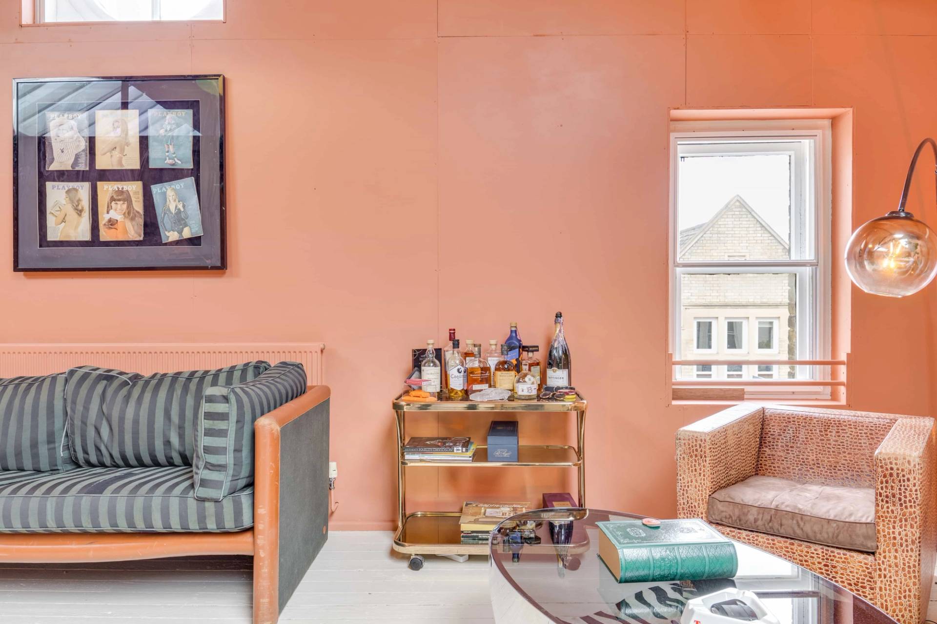 Vintage drinks trolley bar cart setup against terracotta pink walls for lifestyle brand photography, Love Locations.