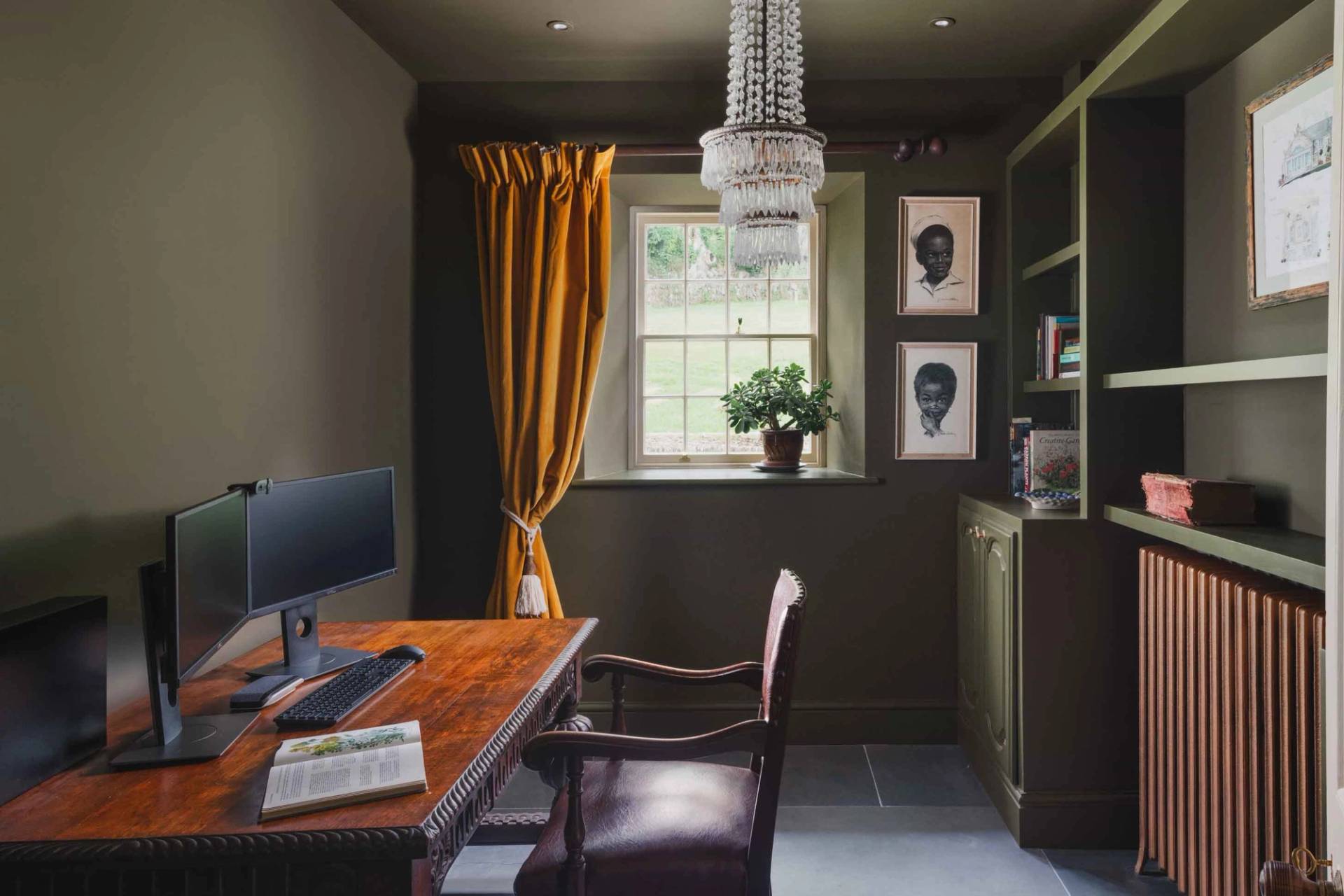 Dark green home office or study film location in Newquay Cornwall TR8 by Love Locations, featuring a wooden desk and mustard drapes.