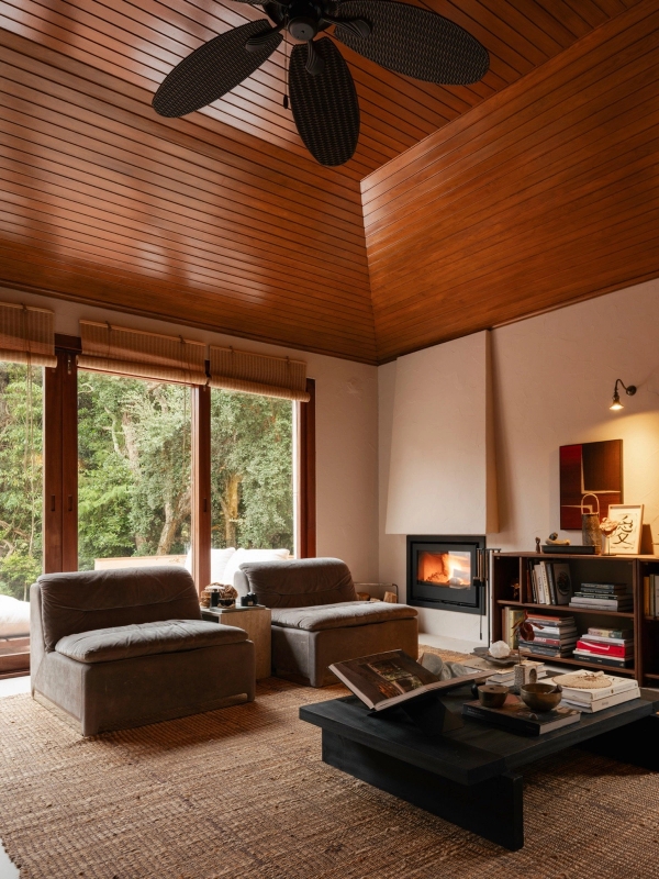 Spacious lounge area featuring a warm timber ceiling, glass sliding doors, and low-profile modern sofas, Love Locations 2705-064.
