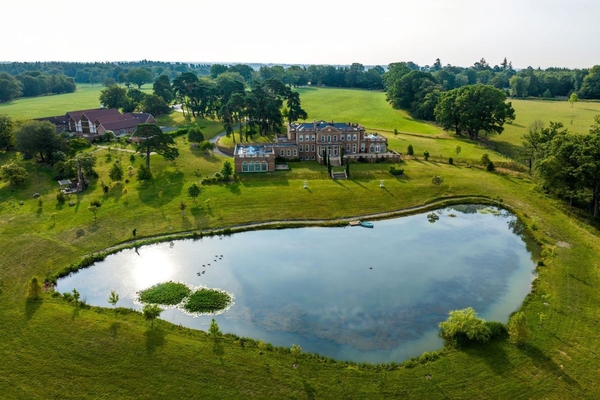 Panoramic drone shot of the expansive Greentrees estate grounds and rolling Sussex countryside, exclusive to Love Locations.