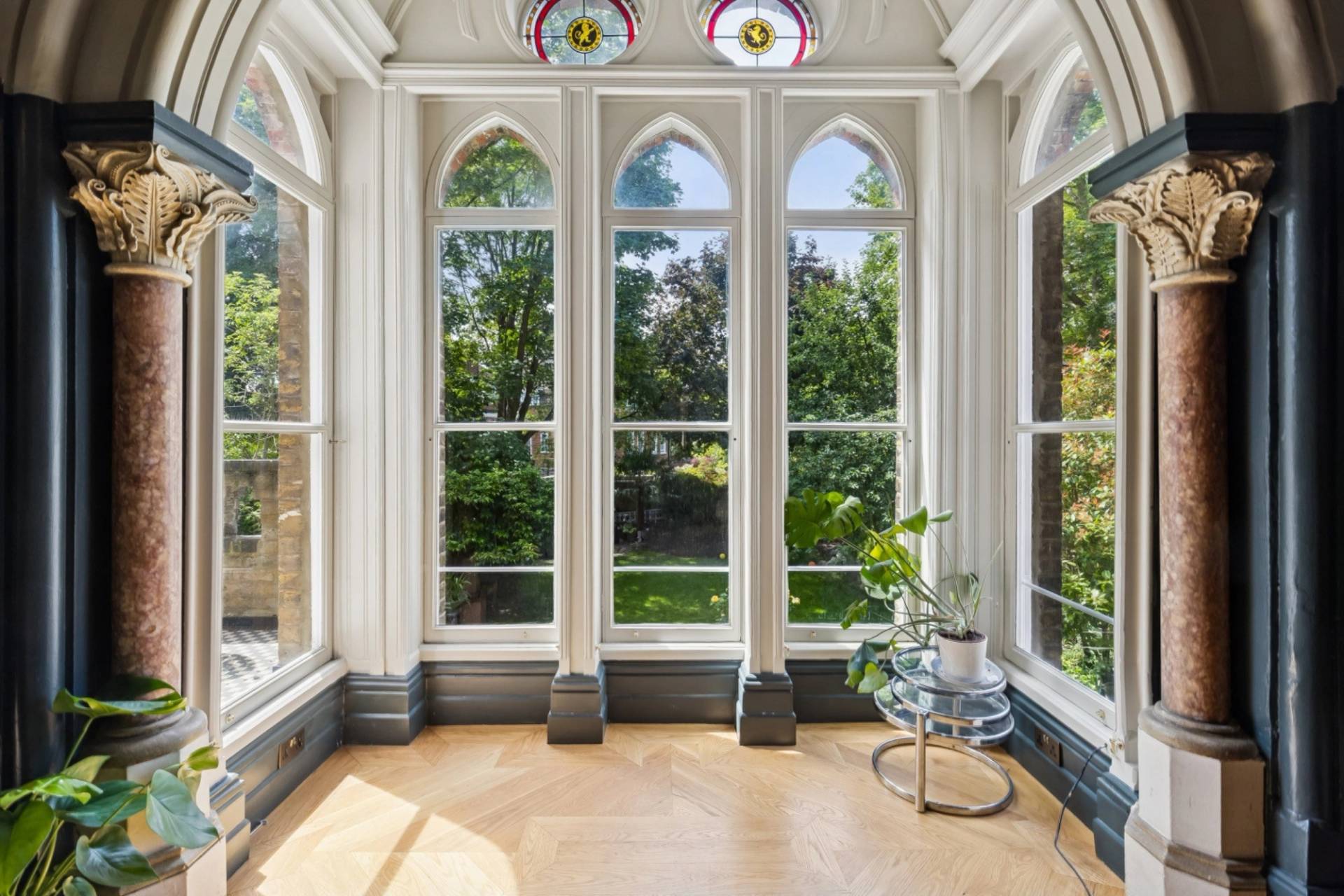 Close-up view of gothic arched stained glass windows in a Hampstead London shoot location curated by Love Locations.