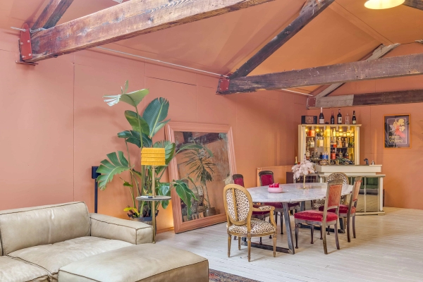 Chic dining room setup featuring a large oval marble table and vintage details, available for hire on Love Locations.