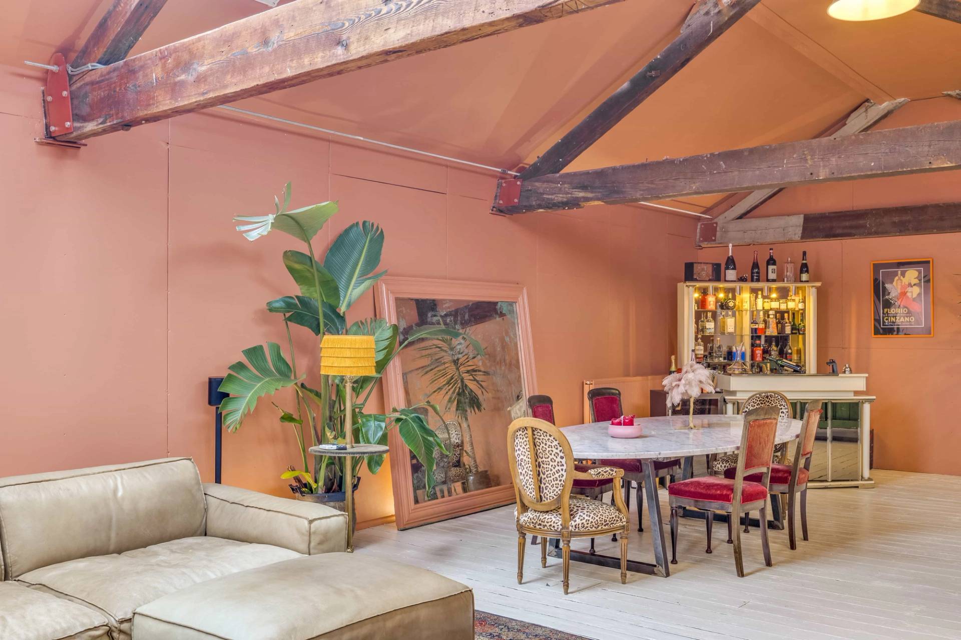 Chic dining room setup featuring a large oval marble table and vintage details, available for hire on Love Locations.