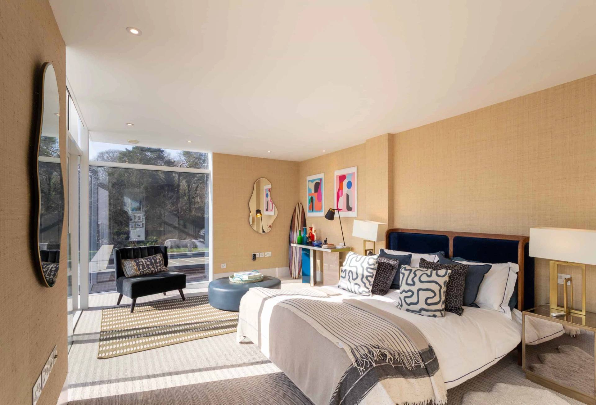 Love Locations eclectic styling location Surrey: Vibrant bedroom scene showcasing a geometric color-block console table and unique art glassware, ideal for interior design staging.