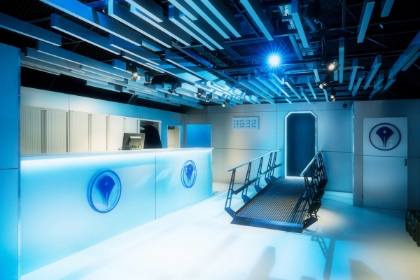 Futuristic blue illuminated reception desk or spaceship terminal deck for corporate events and filming, via Love Locations.