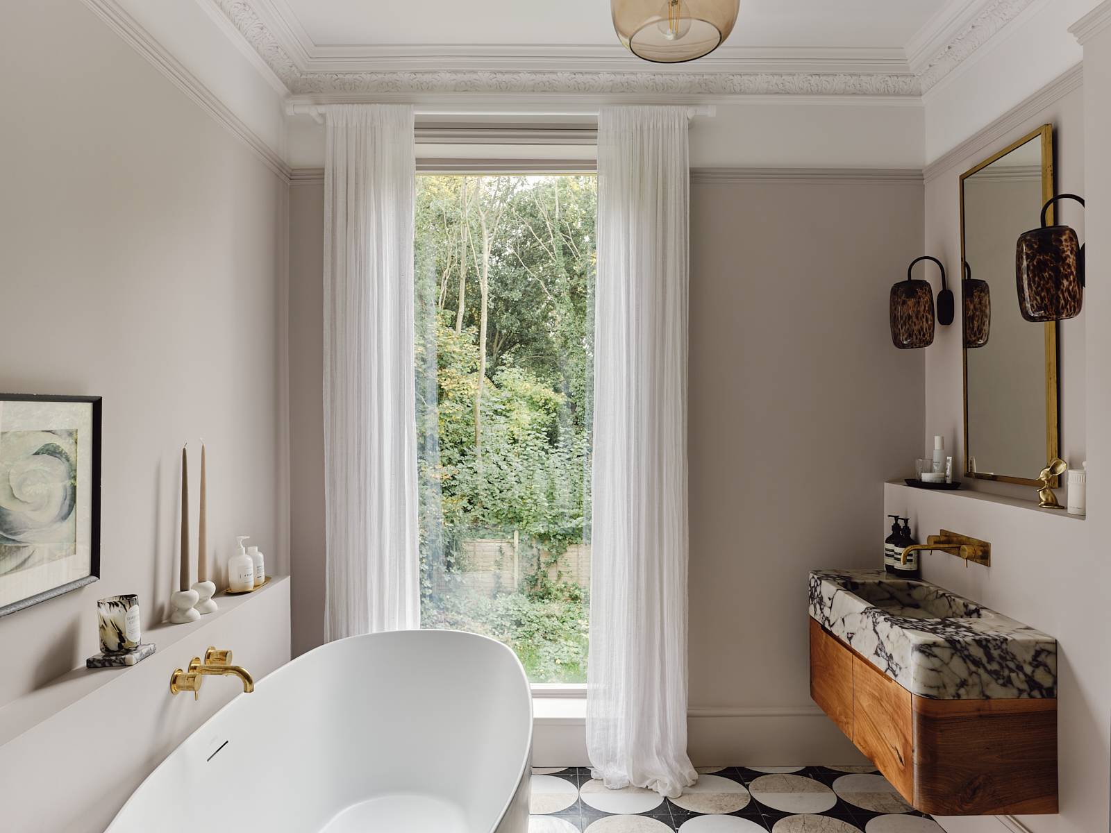 Freestanding white bathtub set beside a large window with sheer drapes and checkerboard tiled flooring, ideal for bath product ads, Love Locations CR0.
