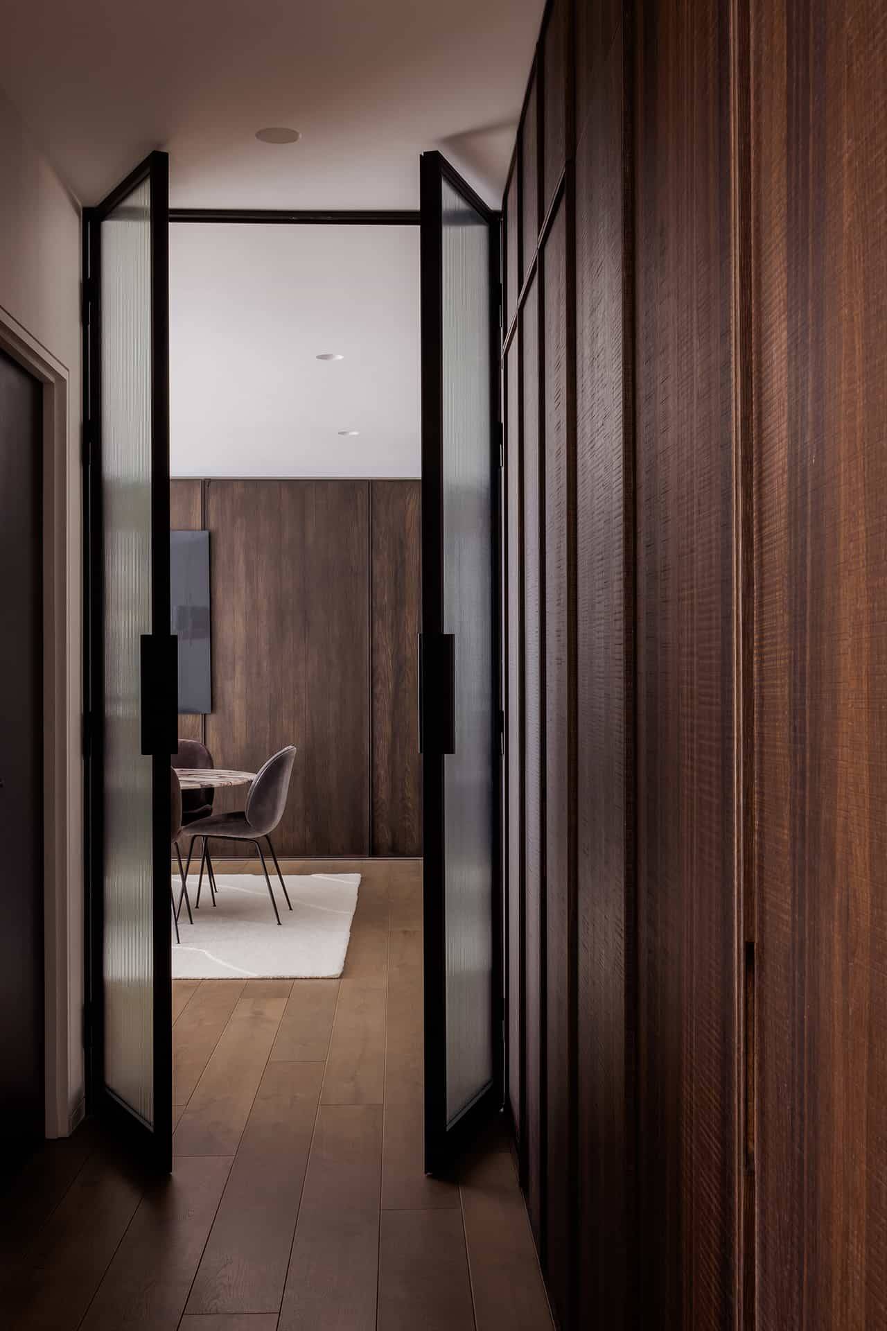 Architectural interior view through sliding wooden doors into a luxury dining setup, available via Love Locations, BR7.