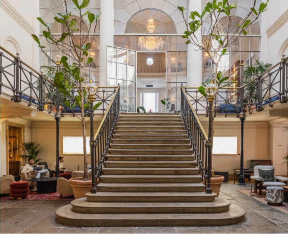 Grand staircase and light-filled atrium at Old Sessions House, creating an impressive entrance for Christmas events.
