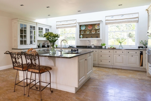 Love Locations country kitchen shoot space Steyning Ashington BN44: Premium white shaker-style kitchen featuring a dark marble island counter and timber floors, perfect for cooking shows and food branding campaigns.