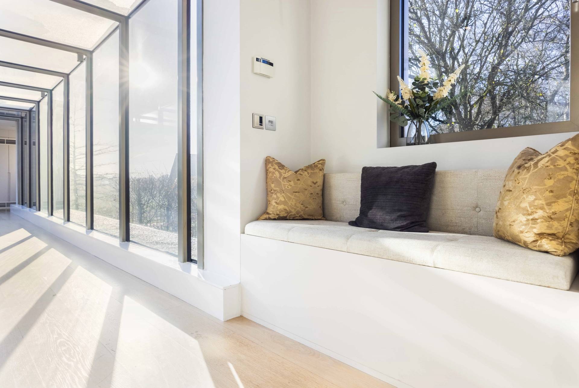 Indoor pool window bench seating cast in soft natural light, ideal for wellness brand campaigns, Love Locations WD7.