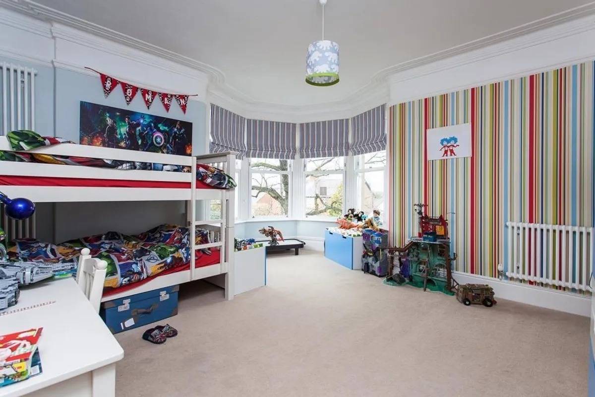 Characterful child’s bedroom or playroom with a traditional bay window in Stockport SK6 via Love Locations.